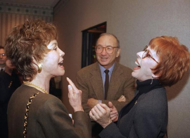 Director of Plaza Suite, Neil Simon with two laughing ladies.