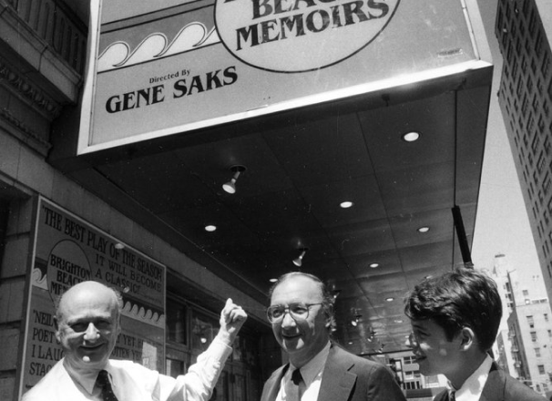 Black and white photo shows Neil Simon and a young Matthew Broderick stand outside a theatre showing Brighton Beach Memoirs in 1983.