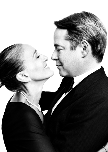 Black and white image of Sarah Jessica Parker and Matthew Broderick. They are both wearing black tie attire and embracing, looking into each other's eyes lovingly.